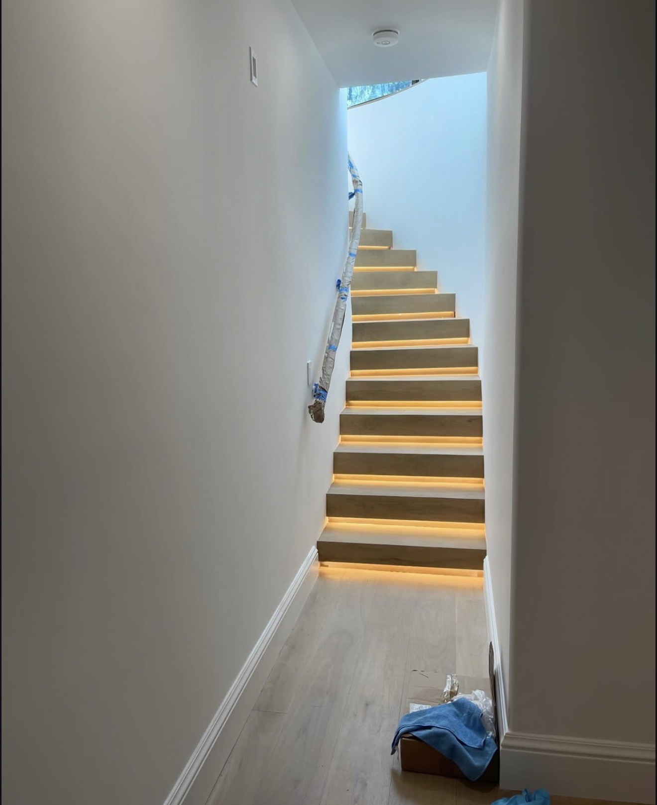 Floating staircase with custom LED riser lighting